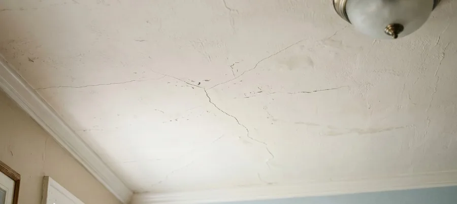 Minor ceiling cracks developing across a plaster ceiling in a Perth home, showing early signs of ceiling movement and ageing materials.