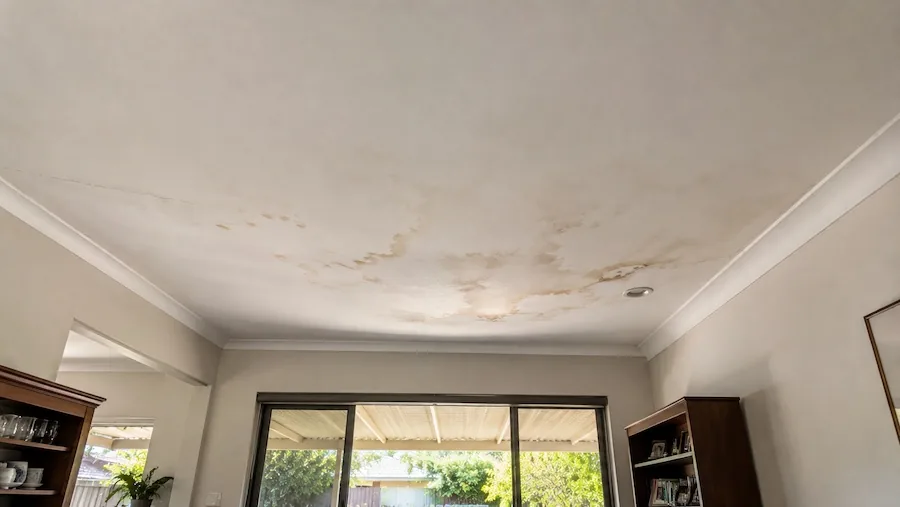 Water damaged bowed ceiling with staining requiring ceiling repair in Perth.