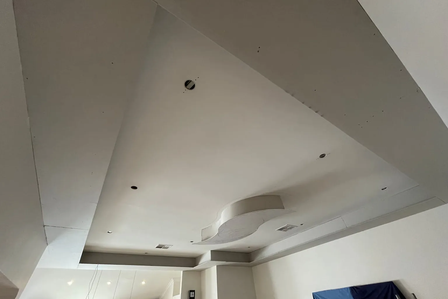 A renovated vaulted ceiling with a new bulkhead in a Perth home