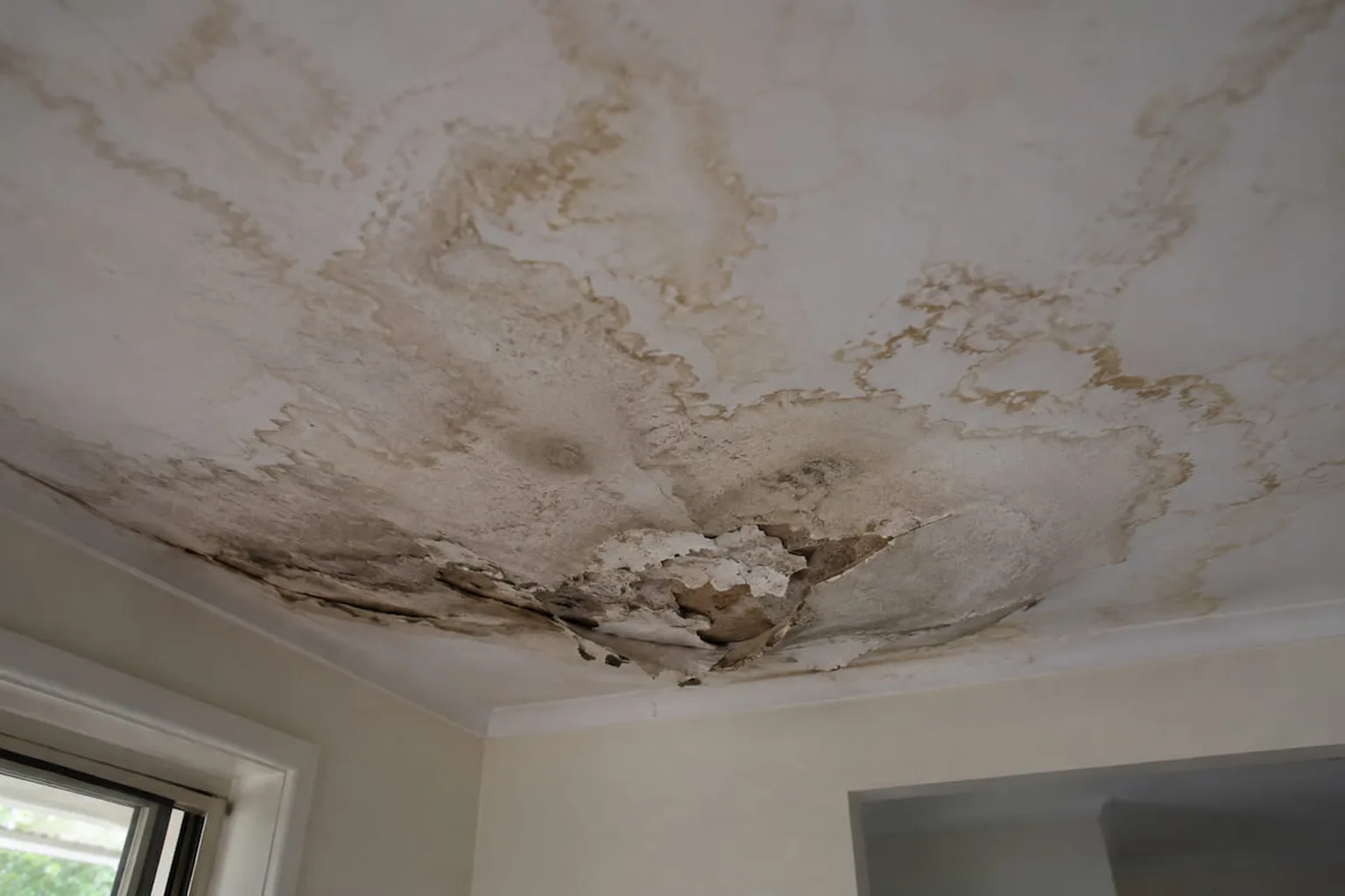 A ceiling opened up after a burst pipe, the room sheeted off and the damage contained