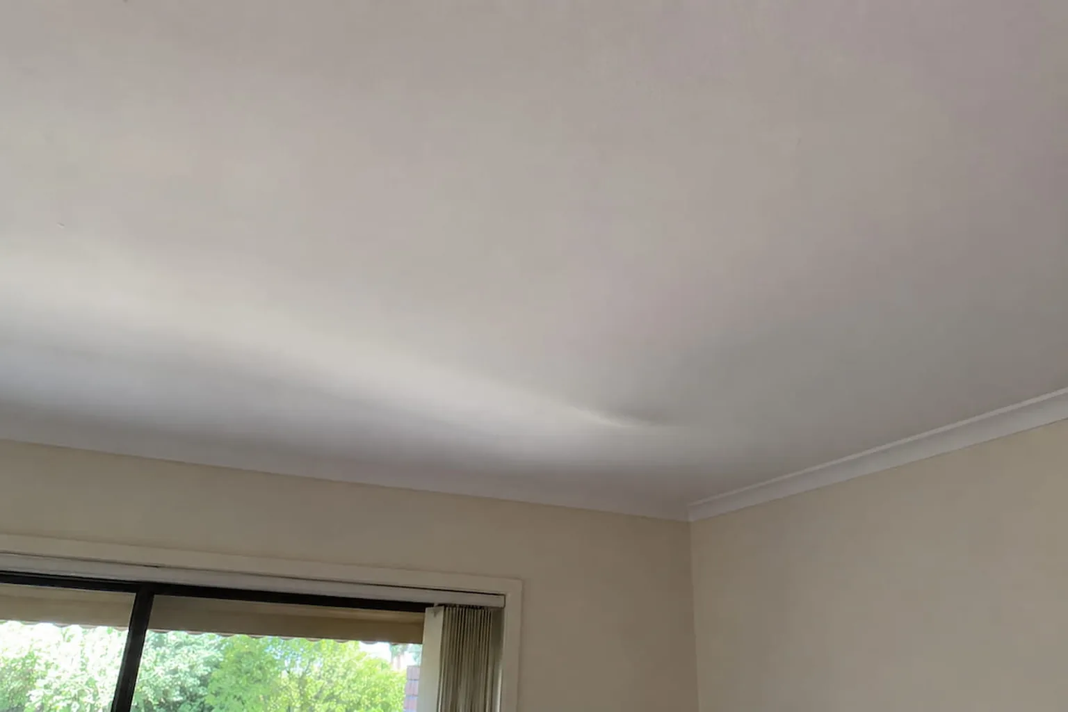 A gyprock ceiling sagging away from the joists in a Perth home