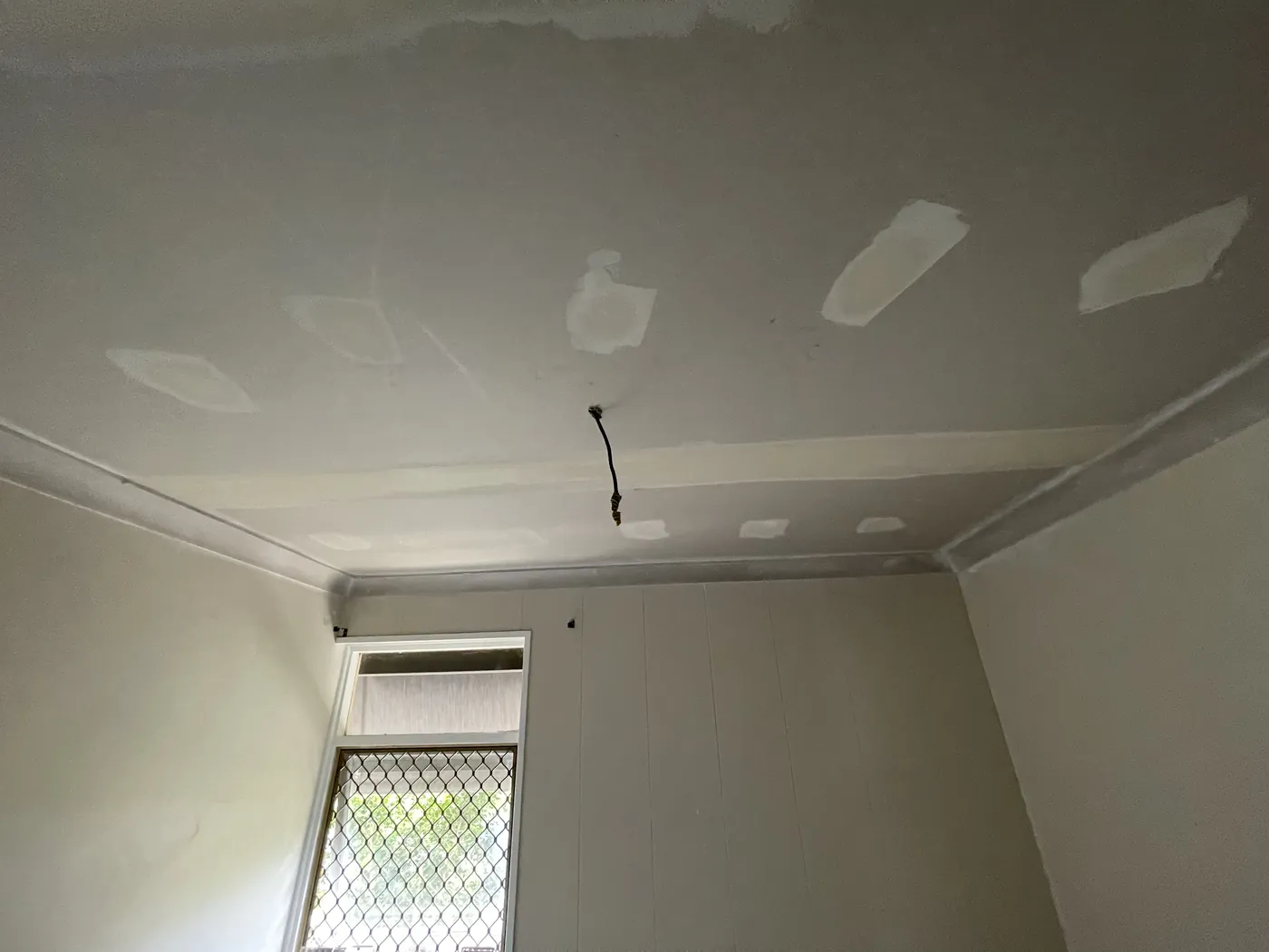 Repaired ceiling joins and screw patches in a small South Perth room