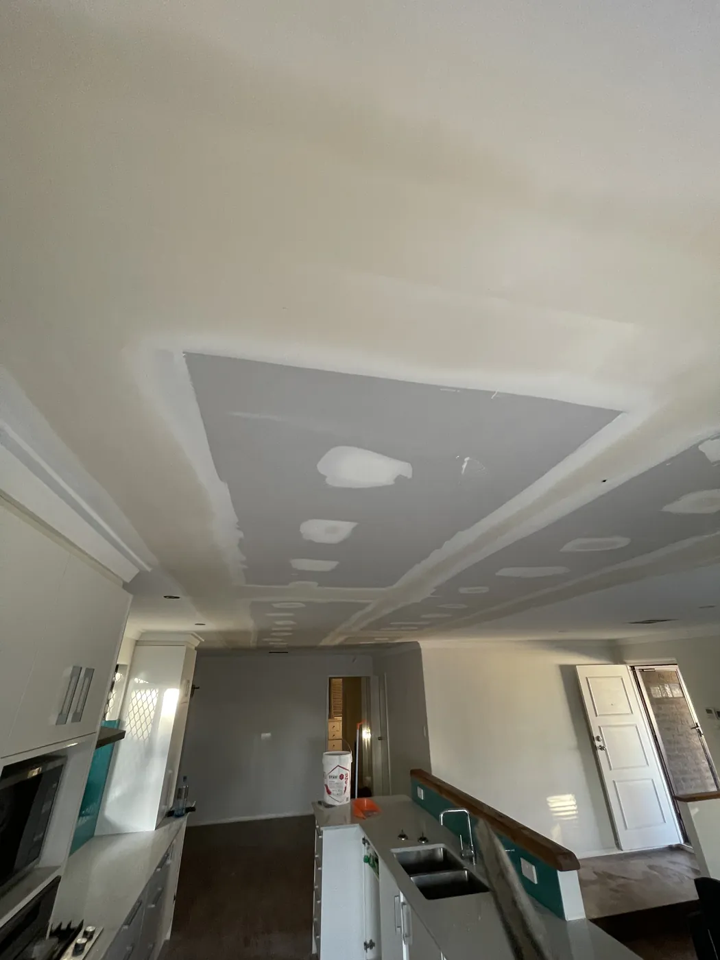 East Perth kitchen ceiling with flushed joins beside the bulkhead and cabinets