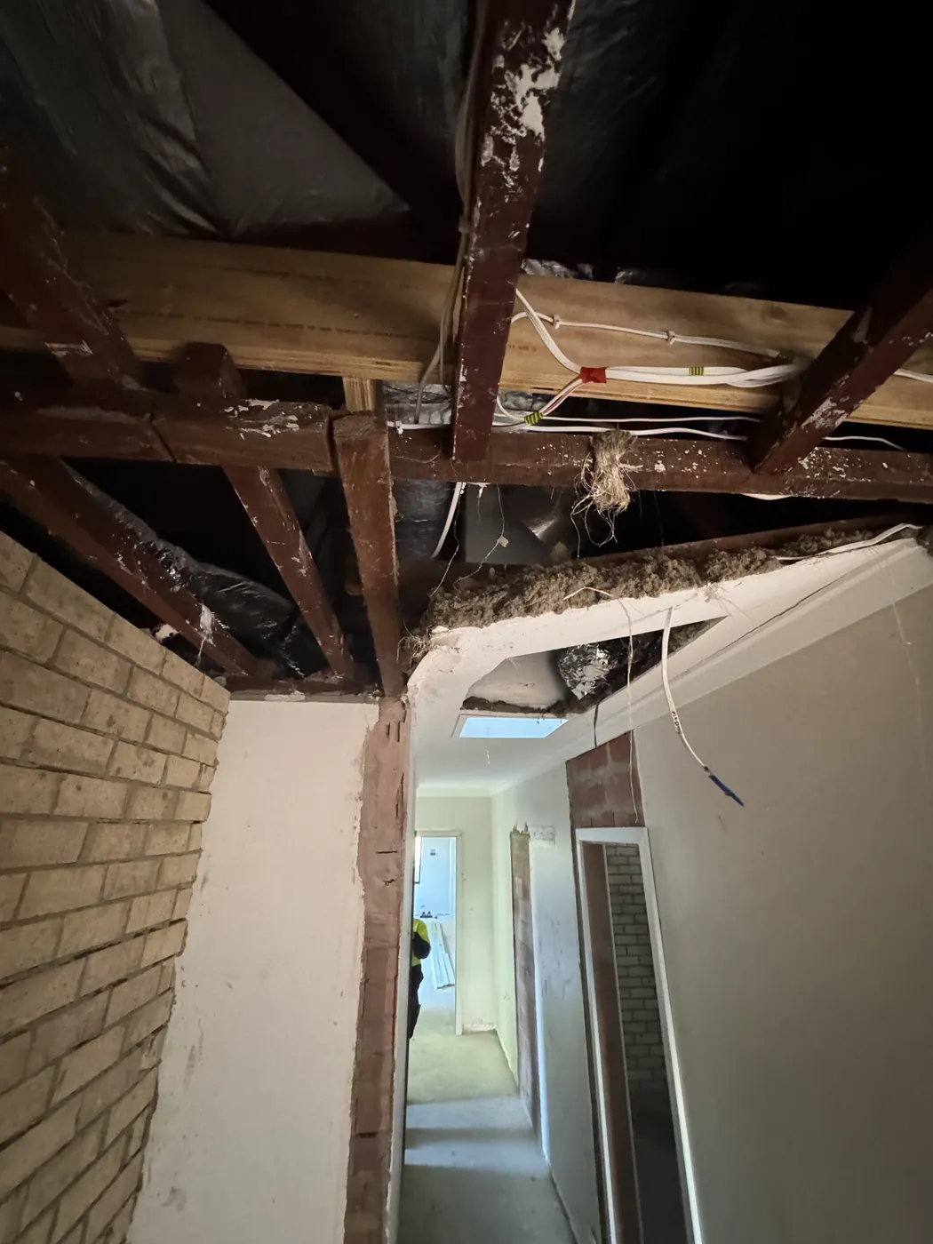 Timber ceiling frame and roof members open after the damaged ceiling came out in Victoria Park