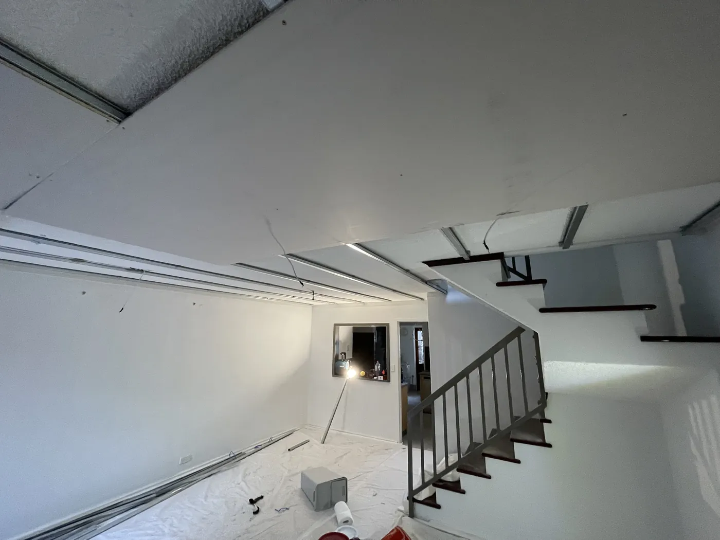 Stairwell area in Bayswater with new ceiling tracks and the first plasterboard going up