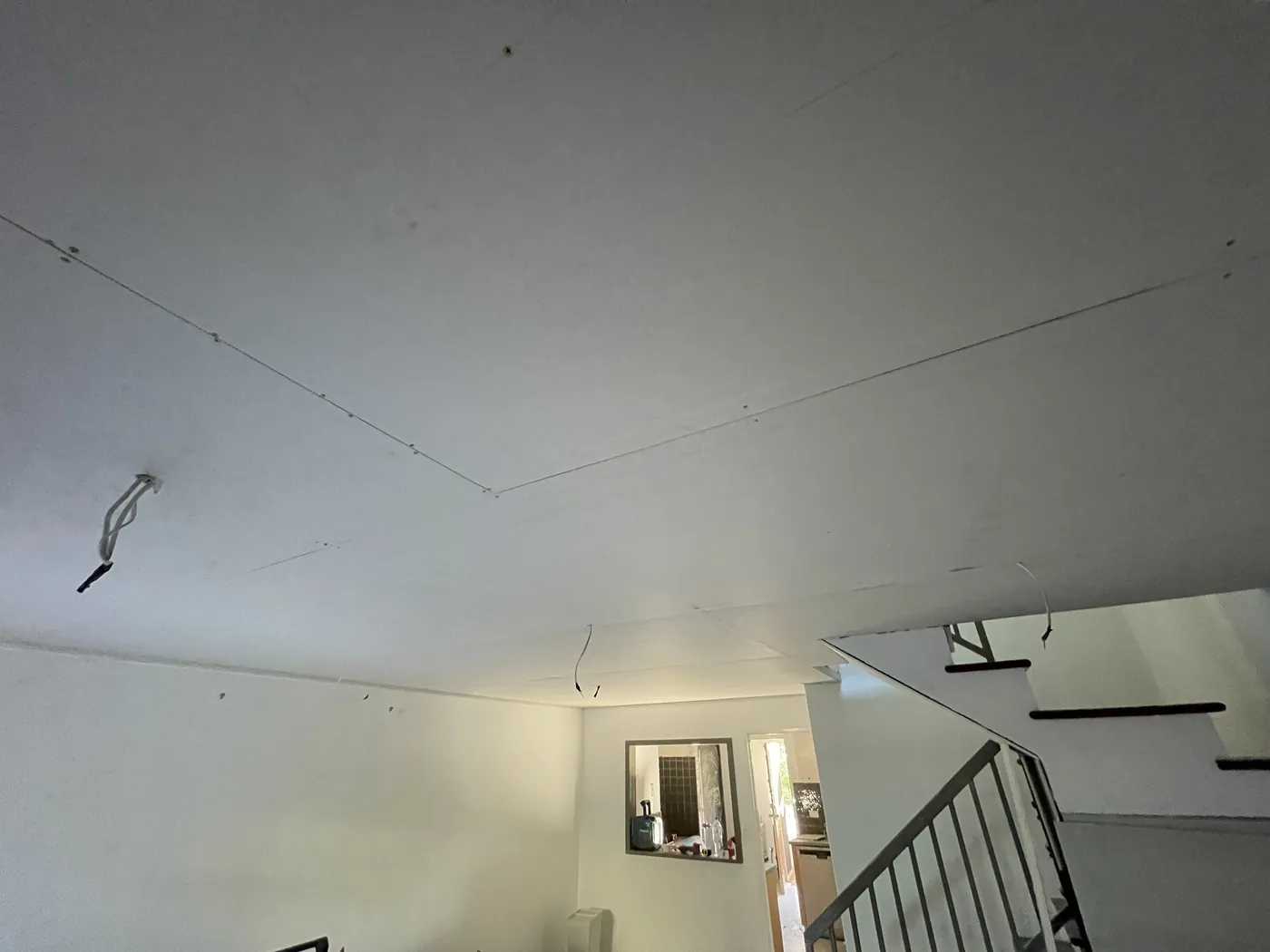 New flat plasterboard ceiling beside the staircase in Bayswater
