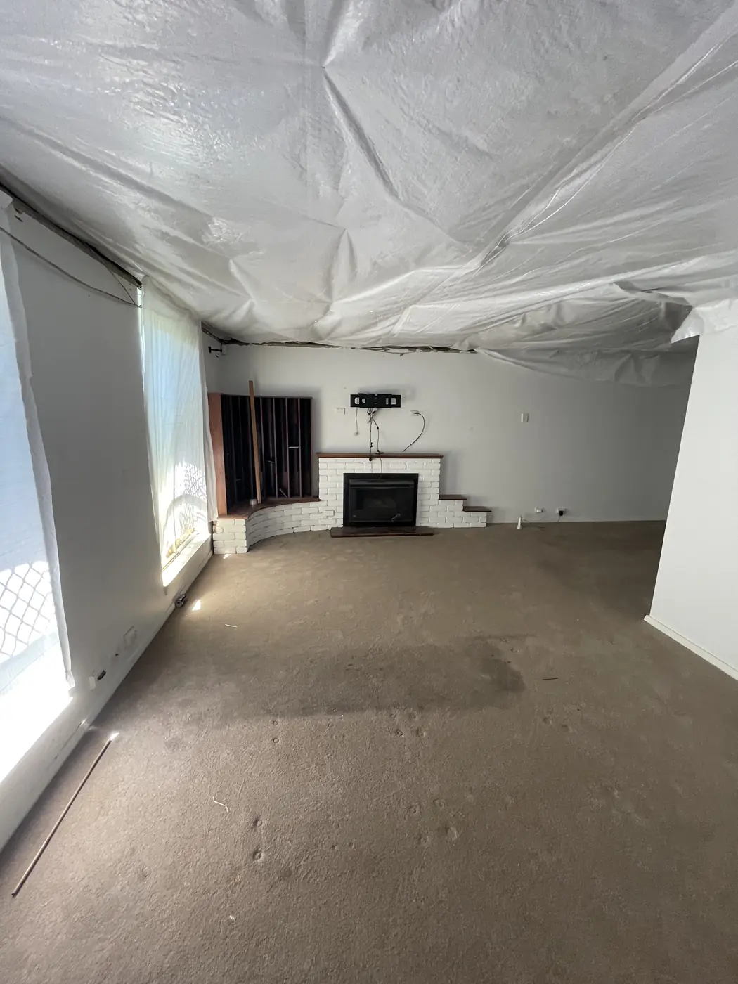 Joondalup lounge with the open ceiling covered in plastic while the new ceiling is prepared