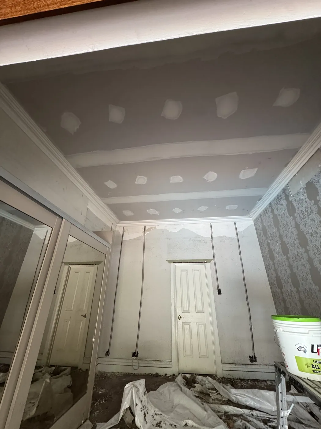 New plasterboard ceiling going up in a narrow Mount Lawley room