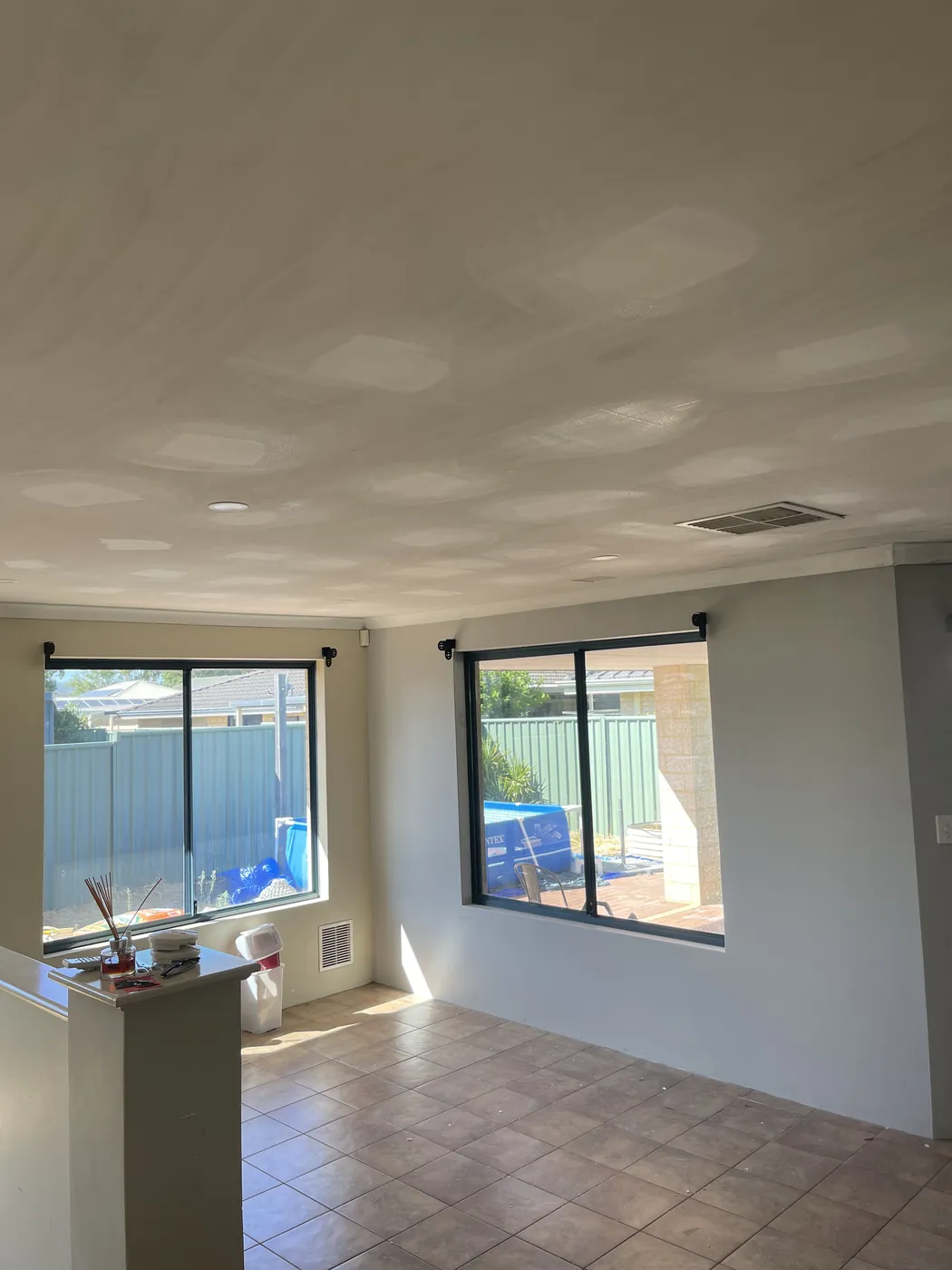 New plasterboard ceiling over the living area of a single-storey Rockingham home