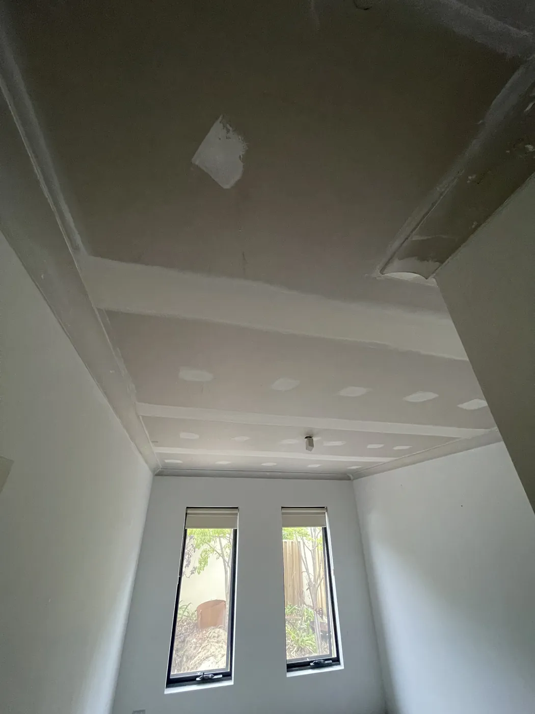 Mandurah room with a sheeted ceiling, flushed joins and a raised section
