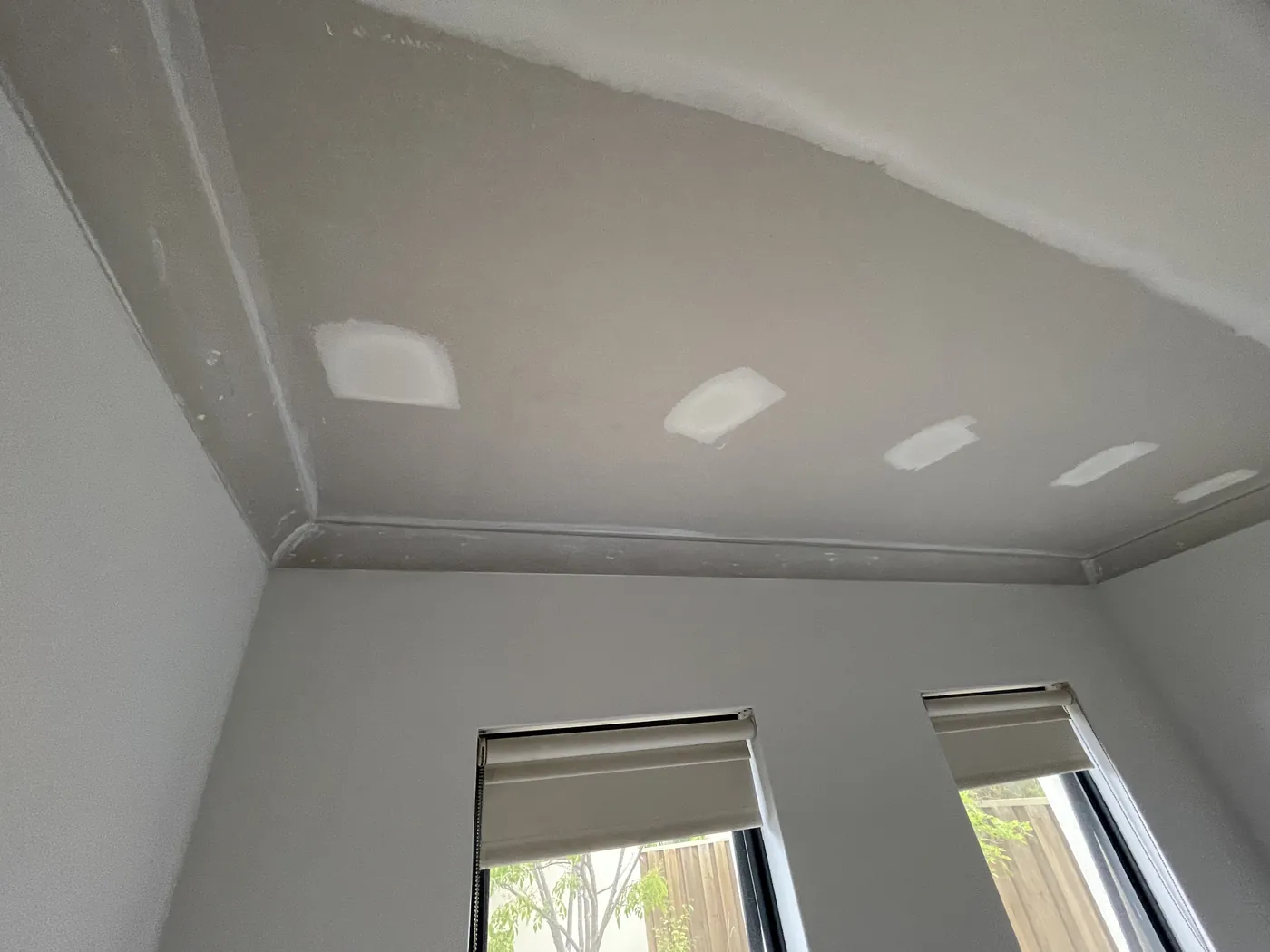 Flushed ceiling joins and cornice above two windows in a Mandurah room