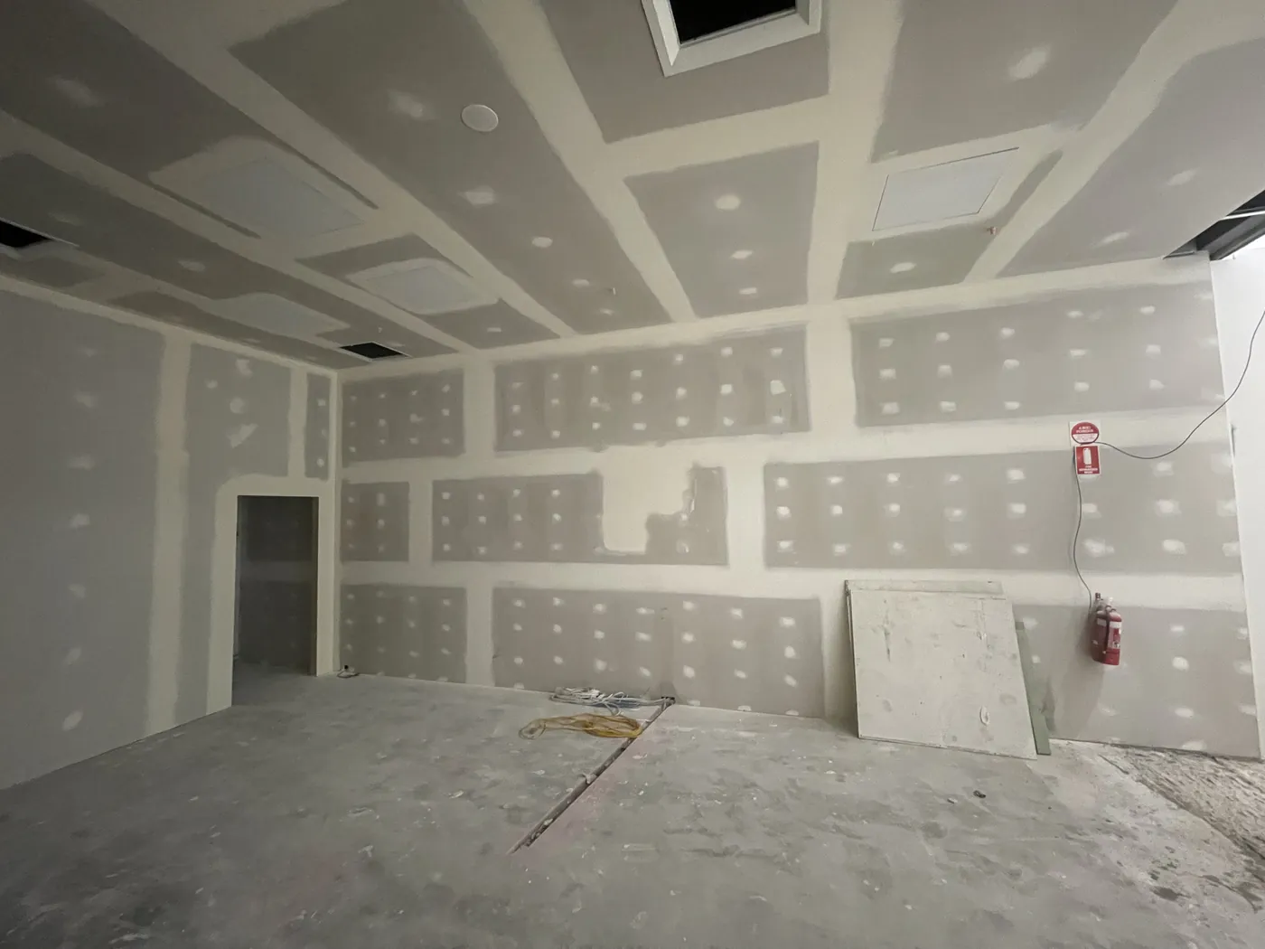 Flushed plasterboard ceiling and walls in a Perth CBD commercial room