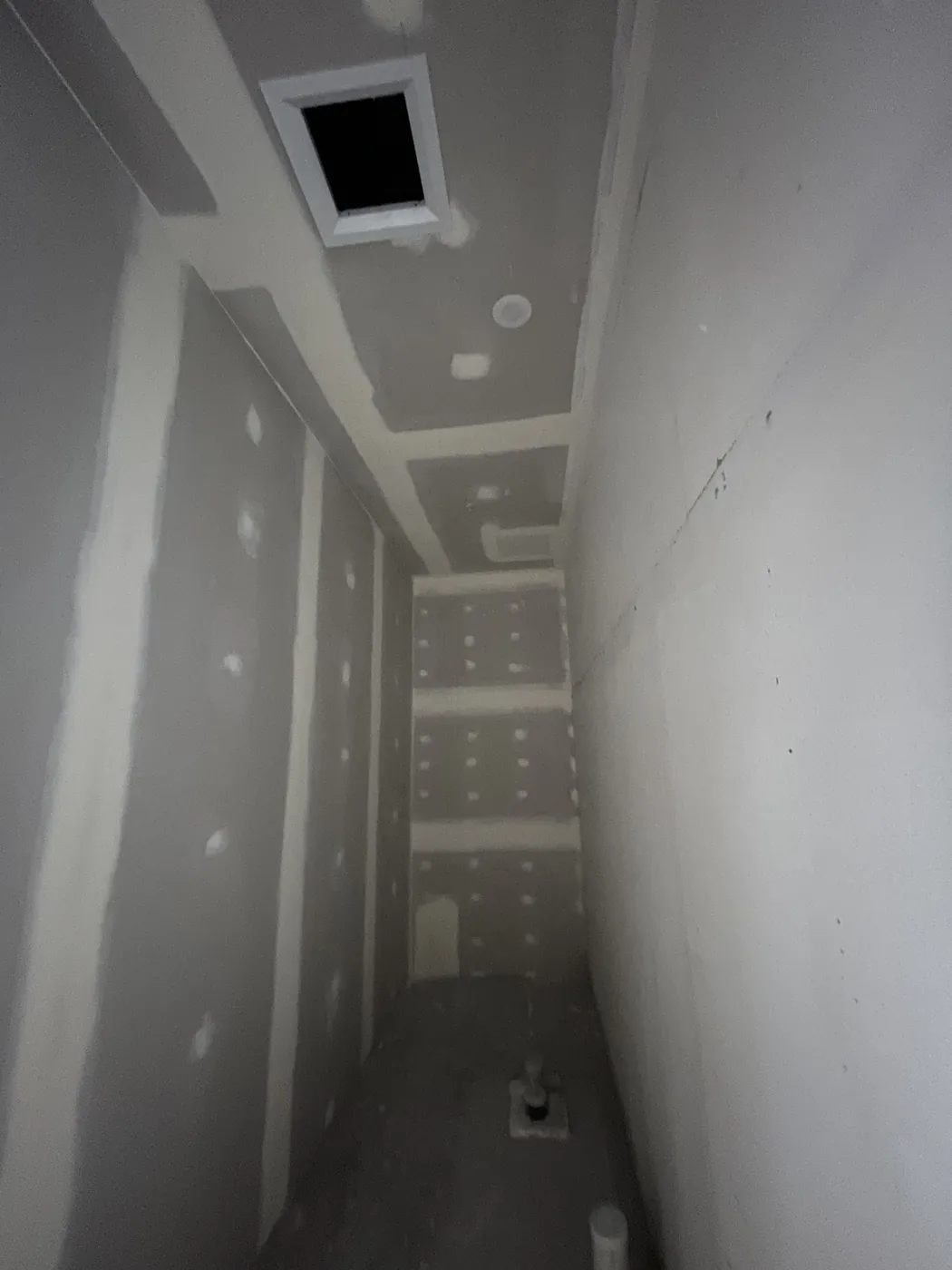 Narrow room in a Perth CBD fit-out with flushed ceiling and wall linings