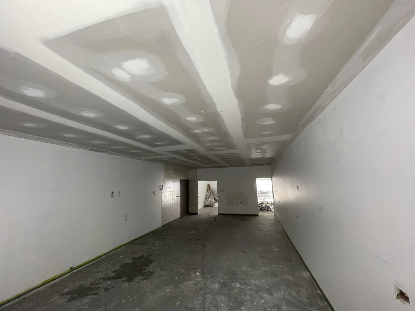Long, narrow space in Balcatta with a new plasterboard ceiling and flushed joins running its length