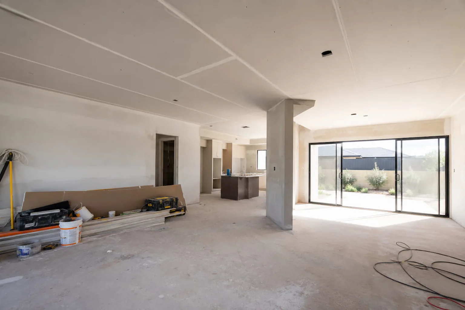 A whole home renovation part way through, the open plan ceiling sheeted and waiting to be set