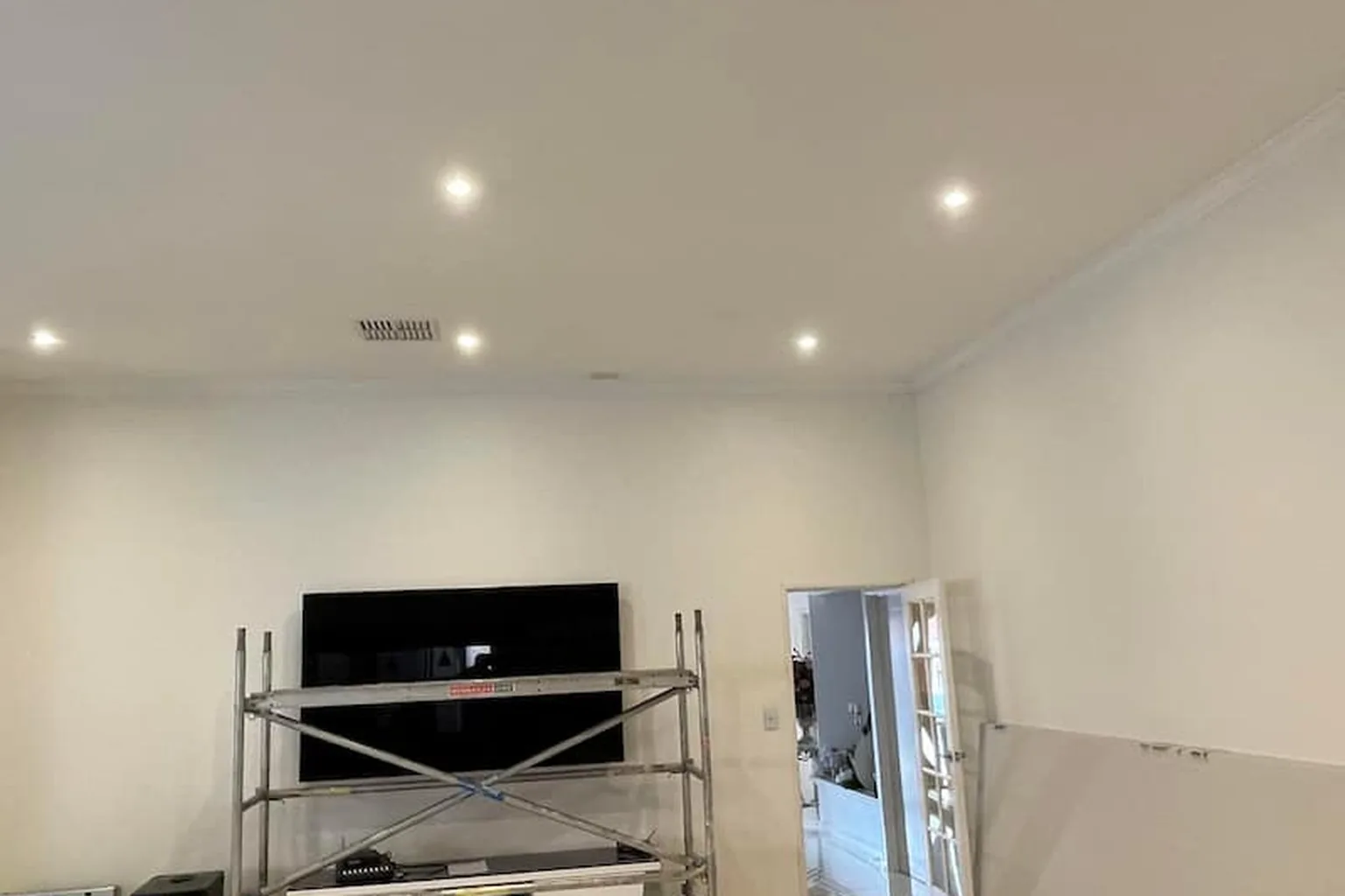 A replaced ceiling in a Perth home, flushed and finished with the trestle still standing under it