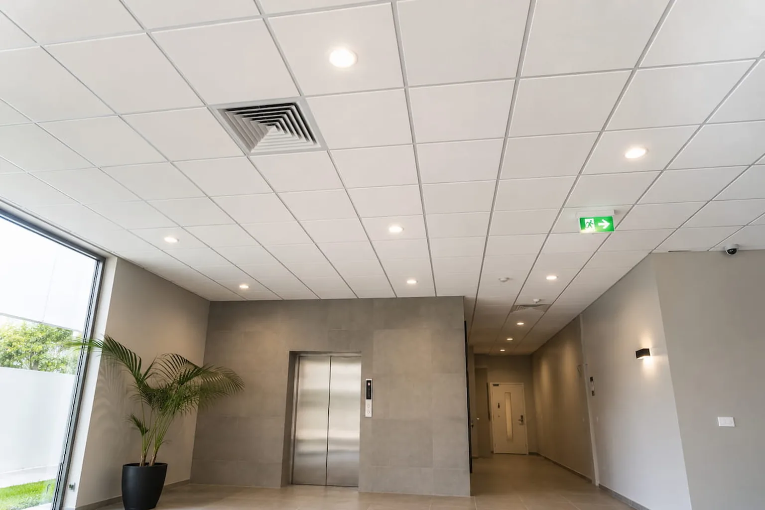 A well maintained suspended ceiling in a commercial foyer